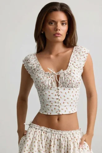 Top corsé de popelín de algodón fruncido Faela con estampado de rosas