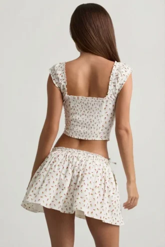 Top corsé de popelín de algodón fruncido Faela con estampado de rosas