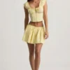 Top corsé de popelín de algodón fruncido Faela en amarillo limón