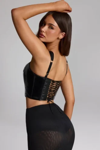 Top corsé de vinilo con cordones Lamiya en negro