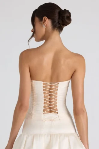 Top corsé sin tirantes con fruncidos y cordones Melvina en color marfil