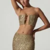 Top corto con aberturas y adornos Ariana en dorado