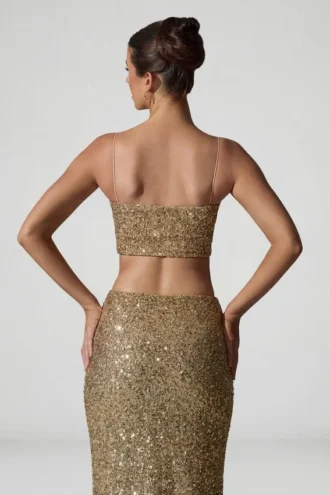 Top corto con aberturas y adornos Ariana en dorado