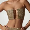 Top corto con aberturas y adornos Ariana en dorado