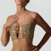 Top corto con aberturas y adornos Ariana en dorado