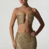 Top corto con aberturas y adornos Ariana en dorado