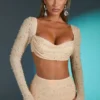 Top corto con cuello vuelto y adornos de La Desirade en color arena