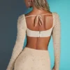 Top corto con cuello vuelto y adornos de La Desirade en color arena