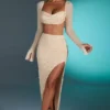 Top corto con cuello vuelto y adornos de La Desirade en color arena