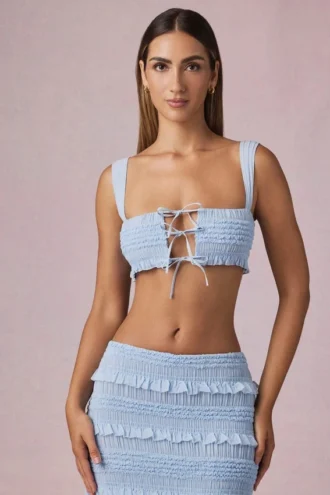 Top corto con volantes y lazo delantero Ottilie en azul claro