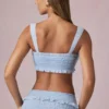 Top corto con volantes y lazo delantero Ottilie en azul claro