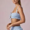 Top corto con volantes y lazo delantero Ottilie en azul claro