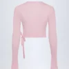 Top corto cruzado Lou de punto calado en rosa bebé