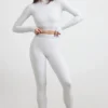 Top corto de cuello alto y manga larga con espalda descubierta en gris jaspeado