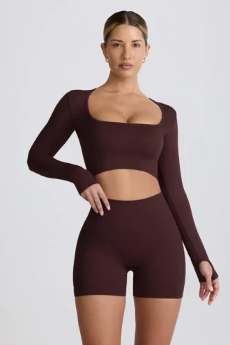 Top corto de manga larga sin costuras Super Sculpt en color chocolate