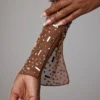 Top corto de manga larga transparente con adornos Guilia en color moca