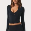 Top cruzado de jersey suave en negro