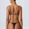 Top de bikini con aberturas y adornos de cadena Sanibel en negro