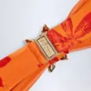 Top de bikini con cuello halter y detalles metálicos Baracoa con estampado de orquídeas naranjas