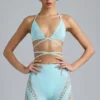 Top de bikini con tirantes cruzados y adornos Liberty en azul hielo