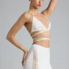Top de bikini con tirantes cruzados y adornos Liberty en color marfil