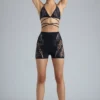 Top de bikini con tirantes cruzados y adornos Liberty en negro
