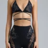Top de bikini con tirantes cruzados y adornos Liberty en negro