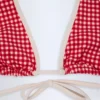 Top de bikini Morella con cuello halter en cuadros rojos