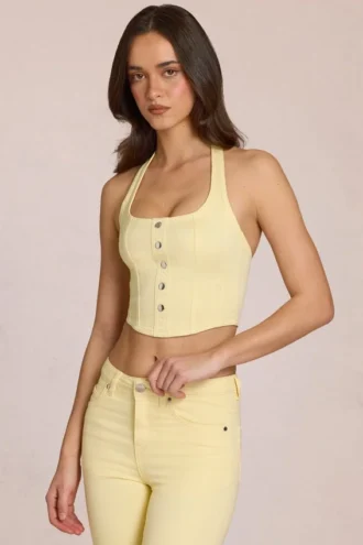 Top de denim con cuello halter estilo corsé de Elowis en amarillo limón