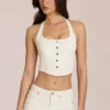 Top de denim con cuello halter estilo corsé de Elowis en color marfil
