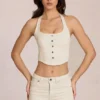 Top de denim con cuello halter estilo corsé de Elowis en color marfil