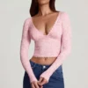 Top de manga larga con escote pronunciado de encaje transparente Lioren en rosa