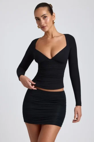 Top de manga larga con fruncidos Emry Modal en negro