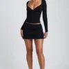 Top de manga larga con fruncidos Emry Modal en negro