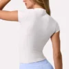 Top Soft Active con cremallera de un cuarto en color Milk