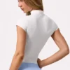 Top Soft Active con cremallera de un cuarto en color Milk