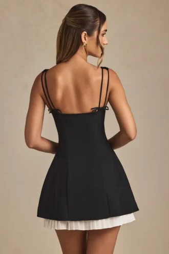 Vestido corto A-line plisado con lazo Cressida en negro