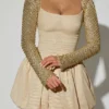Vestido corto Aletta con volantes en el bajo y adornos dorados