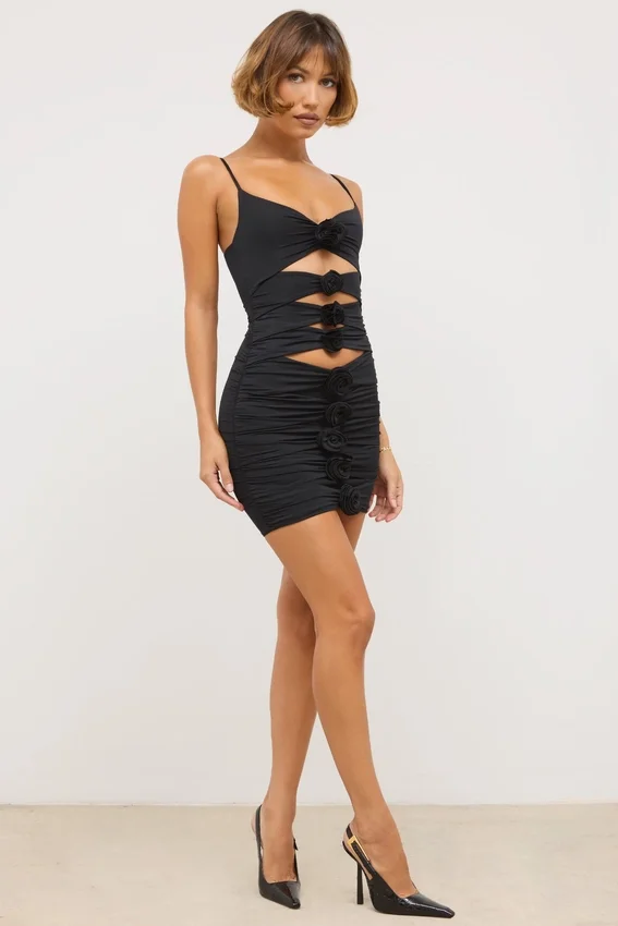 Vestido corto Aniela de jersey elástico con detalles de rosas y aberturas en negro Vestido corto Aniela de jersey elástico con detalles de rosas y aberturas en negro