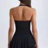 Vestido corto asimétrico con cuello halter y capas Rosaria en negro Vestido corto asimétrico con cuello halter y capas Rosaria en negro