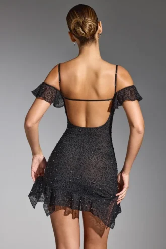 Vestido corto Beaufort con hombros al aire y adornos en negro