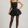 Vestido corto Cirilla con detalle de lazo y bajo abullonado en negro