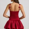 Vestido corto Cirilla con detalle de lazo y bajo abullonado en rojo intenso