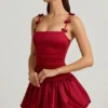 Vestido corto Cirilla con detalle de lazo y bajo abullonado en rojo intenso