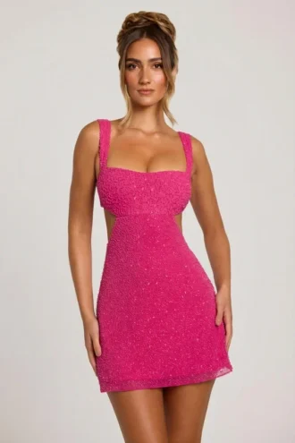 Vestido corto con aberturas y adornos Emilion en fucsia
