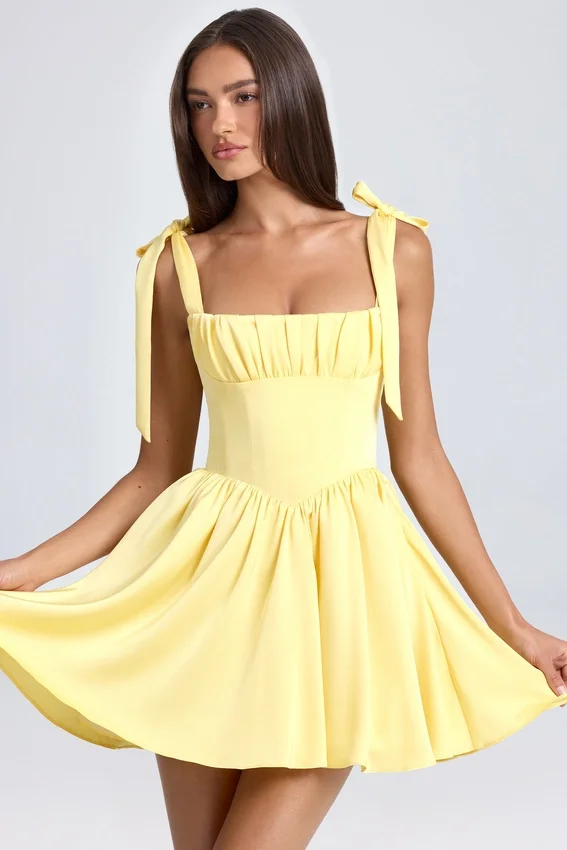Vestido corto con corsé drapeado Bellamy en color sorbete de limón