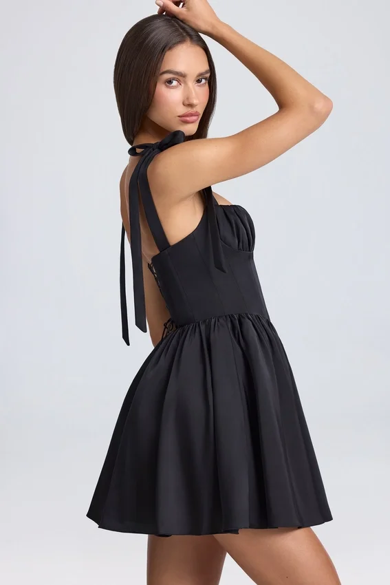 Vestido corto con corsé drapeado Bellamy en negro Vestido corto con corsé drapeado Bellamy en negro