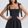 Vestido corto con corsé drapeado Bellamy en negro Vestido corto con corsé drapeado Bellamy en negro