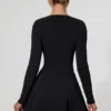 Vestido corto de corte A con escote pronunciado y detalle de lazo Graciela en negro Vestido corto de corte A con escote pronunciado y detalle de lazo Graciela en negro
