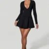 Vestido corto de corte A con escote pronunciado y detalle de lazo Graciela en negro Vestido corto de corte A con escote pronunciado y detalle de lazo Graciela en negro